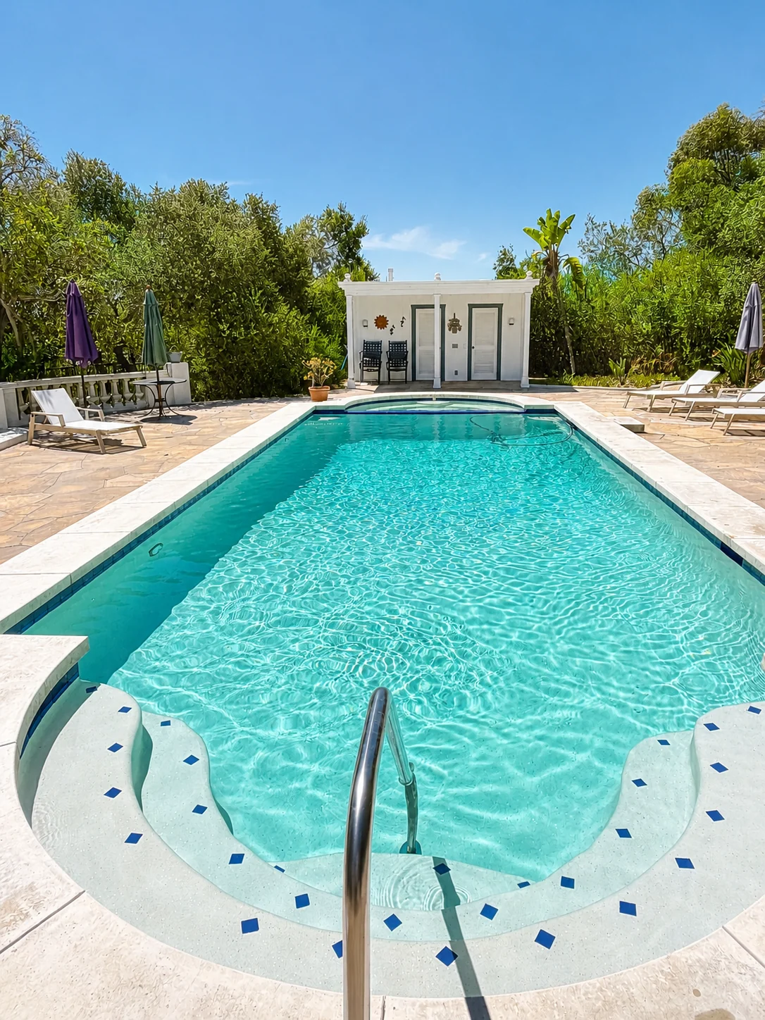 Residential pool cleaning in Santa Barbara with spotless curved entry steps
